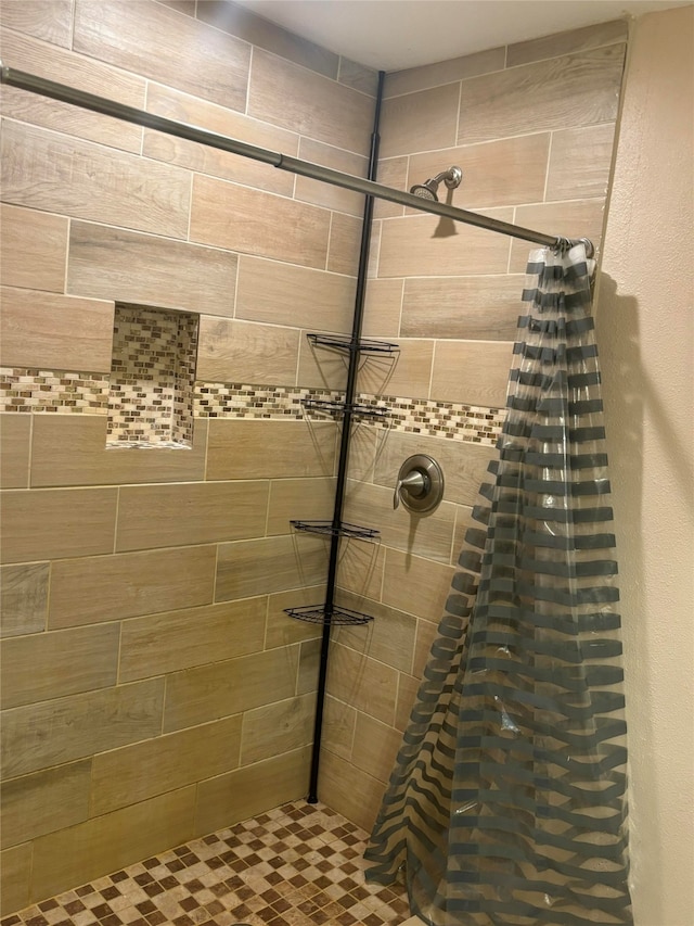 bathroom featuring curtained shower