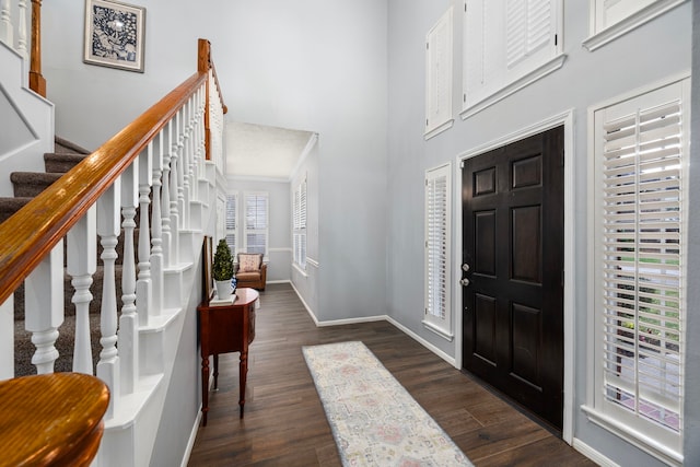 foyer with dark hardwood / wood-style flooring