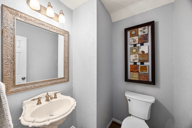 bathroom with sink and toilet