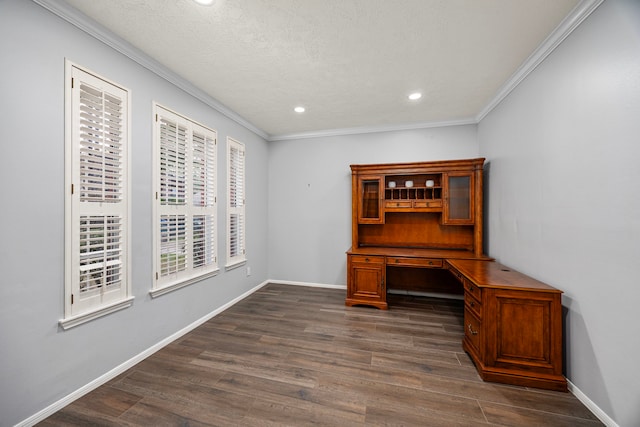 office area with dark hardwood / wood-style flooring, a textured ceiling, built in desk, and crown molding