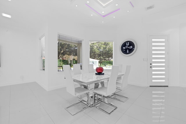 dining space featuring light tile patterned flooring