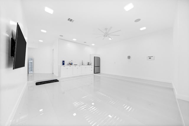 spare room featuring ceiling fan and sink