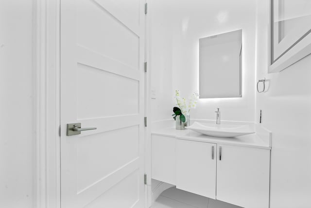 bathroom with vanity and tile patterned floors