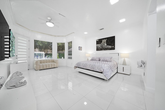 tiled bedroom with ceiling fan