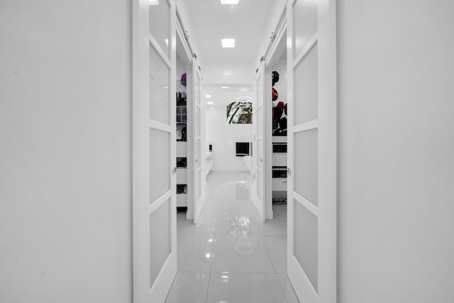 hallway featuring light tile patterned floors