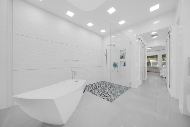 bathroom with shower with separate bathtub