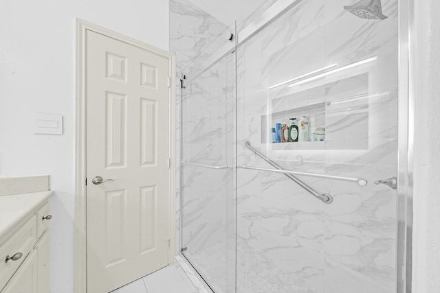 bathroom with an enclosed shower and vanity