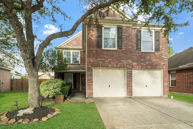 view of front of property with a garage and a front yard