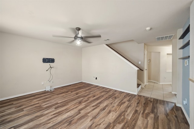 unfurnished room with hardwood / wood-style floors and ceiling fan