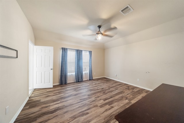 empty room featuring hardwood / wood-style floors and ceiling fan