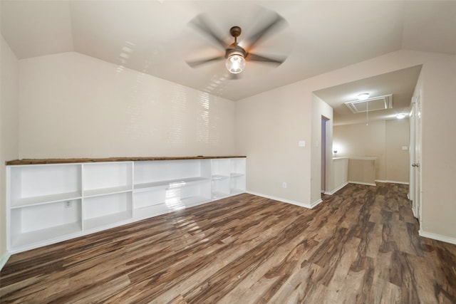 spare room with vaulted ceiling, ceiling fan, and dark hardwood / wood-style flooring