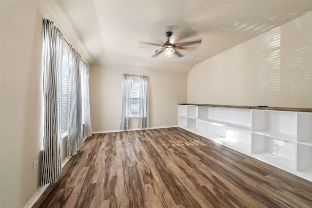 spare room with lofted ceiling, hardwood / wood-style flooring, and ceiling fan