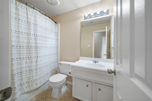 bathroom with toilet, a shower with curtain, vanity, and tile patterned floors