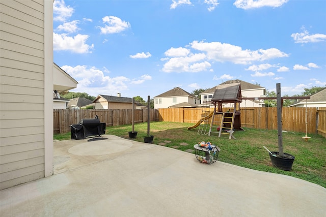 view of patio / terrace featuring a playground and a grill