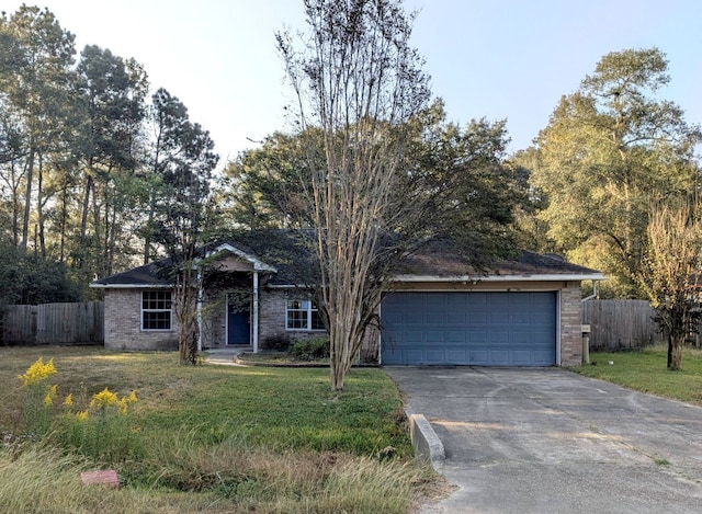 ranch-style house with a garage and a front yard