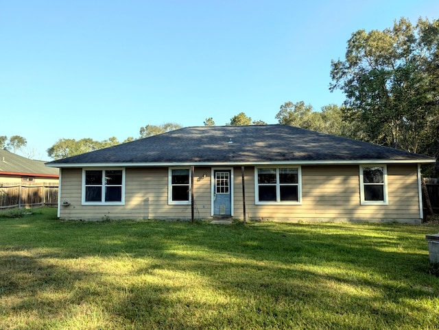 ranch-style home with a front yard