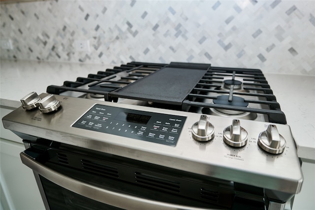 interior details featuring stainless steel gas range oven