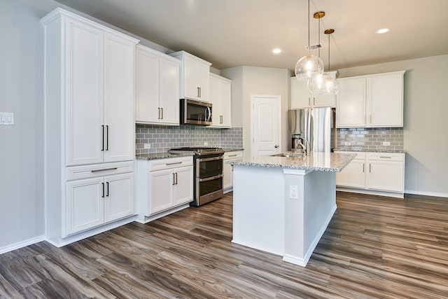 kitchen with white cabinets, decorative backsplash, stainless steel appliances, and dark wood-type flooring