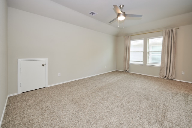 spare room featuring carpet floors and ceiling fan