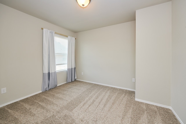 spare room featuring carpet floors