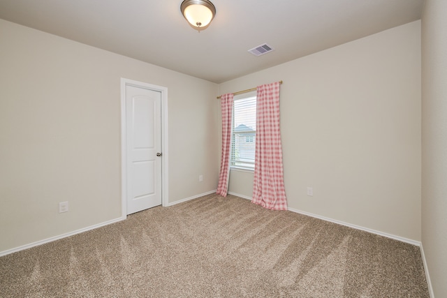 empty room featuring carpet floors