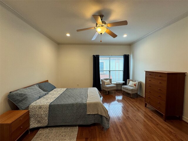 bedroom featuring crown molding, ceiling fan, and hardwood / wood-style floors