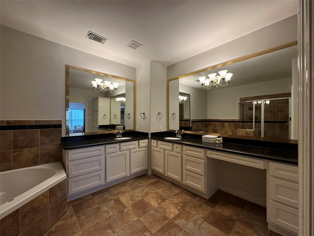 bathroom featuring vanity, plus walk in shower, and a chandelier