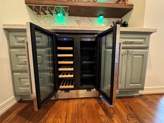 bar with dark hardwood / wood-style floors