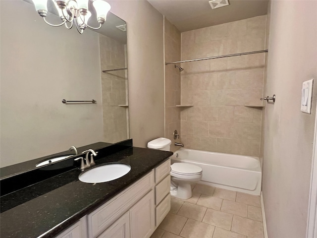 full bathroom featuring tiled shower / bath, vanity, toilet, tile patterned floors, and an inviting chandelier