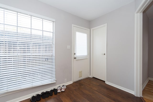 6201 Beverlyhill St Unit 30, Houston, TX 77057 - foyer entrance with dark wood-style flooring, baseboards, and healthy amount of natural light