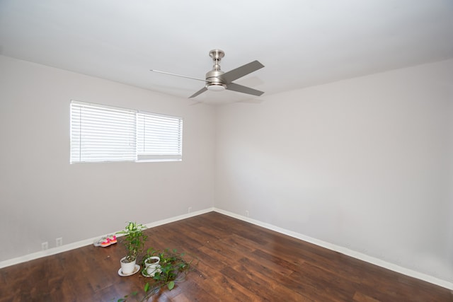 empty room with dark hardwood / wood-style floors and ceiling fan