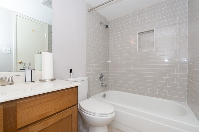 full bathroom with vanity, tiled shower / bath combo, and toilet