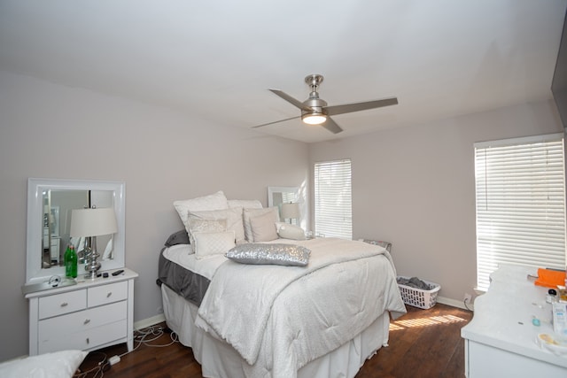 bedroom featuring dark hardwood / wood-style floors and ceiling fan