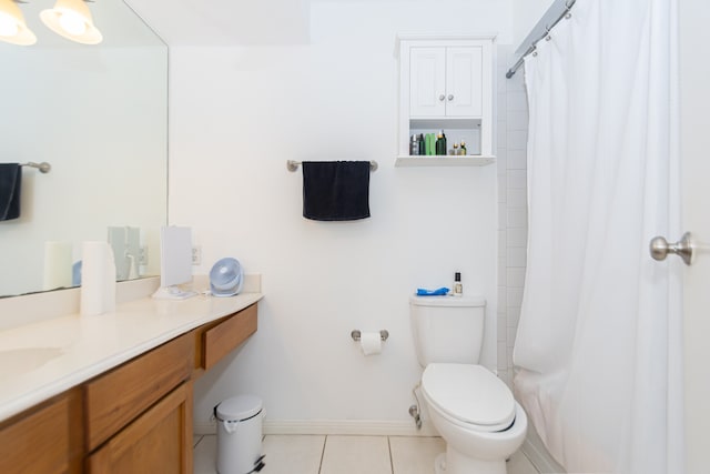 bathroom with tile patterned floors, vanity, a shower with shower curtain, and toilet