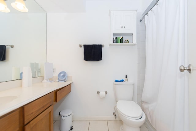 6201 Beverlyhill St Unit 30, Houston, TX 77057 - bathroom featuring tile patterned flooring, toilet, vanity, and curtained shower