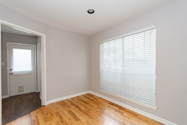 spare room with hardwood / wood-style flooring