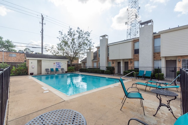 view of swimming pool with a patio area