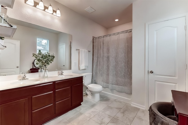 bathroom with tile patterned floors, vanity, curtained shower, and toilet