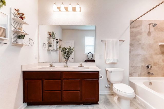 full bathroom with vanity, toilet, and tiled shower / bath