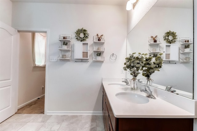 bathroom with tile patterned flooring and vanity