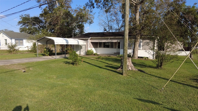 ranch-style home with a front lawn and a carport