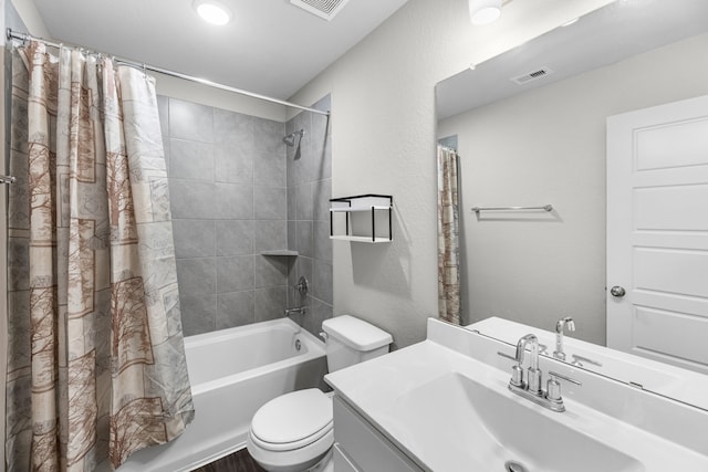 full bathroom featuring vanity, toilet, and shower / tub combo