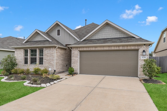 view of front of home with a garage and a front lawn