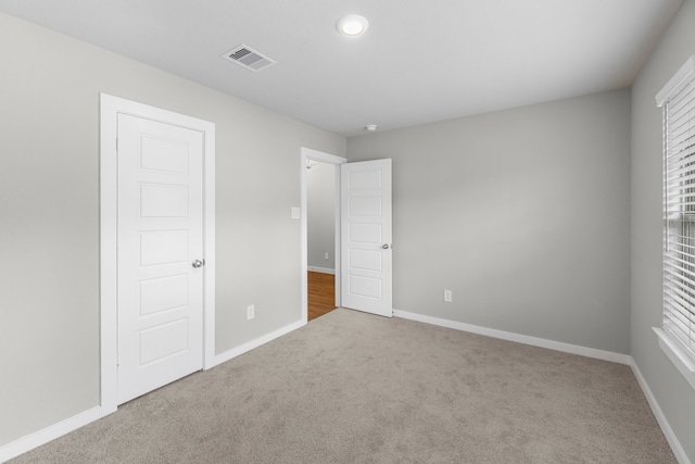 unfurnished bedroom with carpet floors