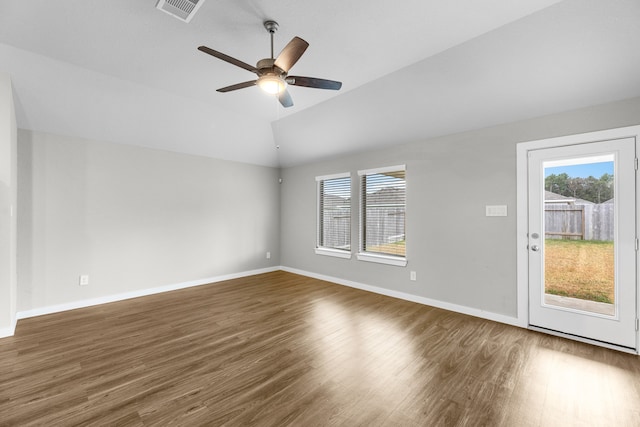 interior space featuring lofted ceiling, dark wood-type flooring, and ceiling fan