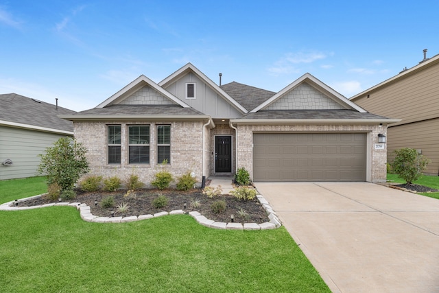 view of front of home featuring a garage and a front yard