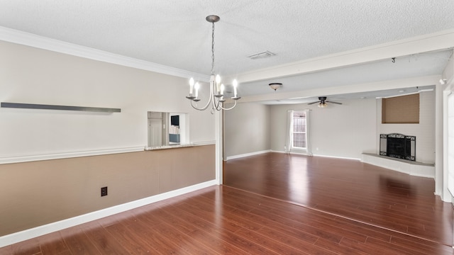 unfurnished dining area with hardwood / wood-style flooring, a textured ceiling, and ornamental molding