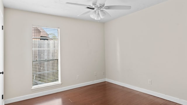 empty room with ceiling fan and wood-type flooring