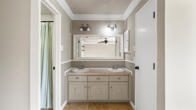 bathroom featuring tile patterned flooring, ceiling fan, a textured ceiling, vanity, and crown molding