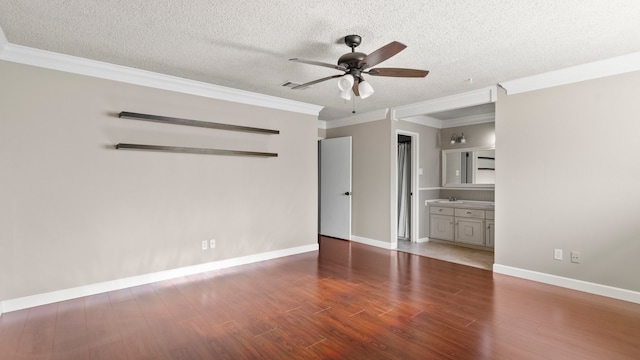 interior space with ceiling fan, dark hardwood / wood-style floors, a textured ceiling, and crown molding